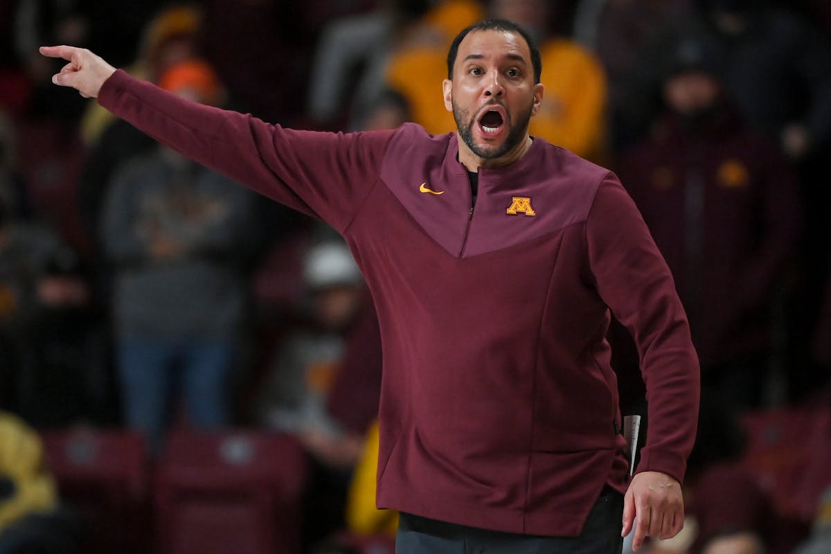 Minnesota Gophers head coach Ben Johnson directs the team during the second half of an NCAA men's basketball game between Minnesota and Purdue at Will