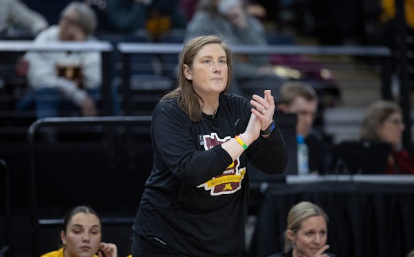 Minnesota Gophers Head Coach Lindsay Whalen coaches from the bench during the fourth quarter of their game in the Big Ten women's basketball tournamen