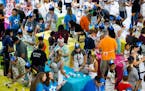 People decorate cupcakes to beat a Guinness World Record for the most cupcakes iced in one hour, during Mall of America�s 25th birthday celebration,