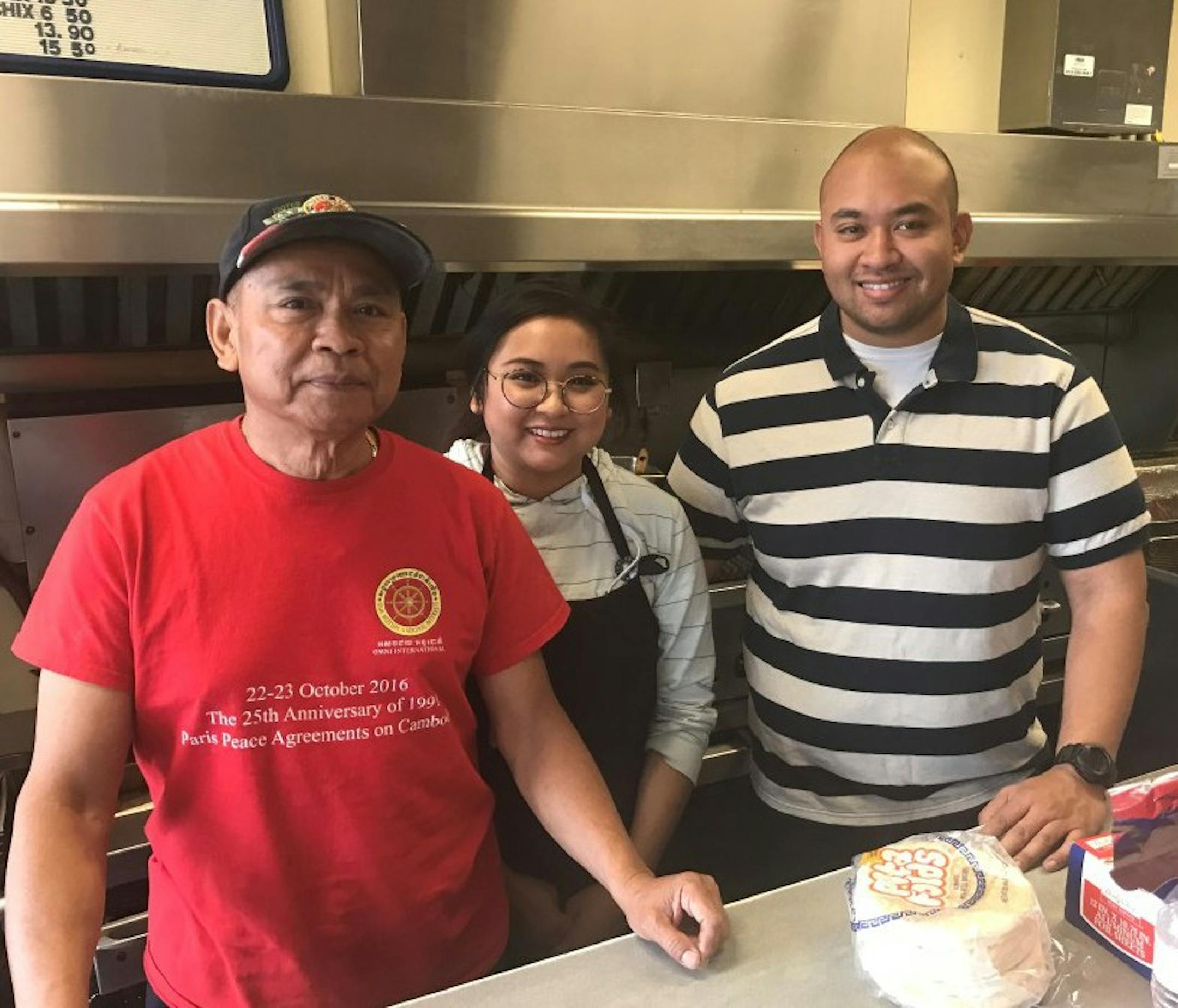 Sophal Nhep stood with daughter Christina, a web designer, and son Nick, an IT business analyst. The kids grew up working at Best Steak & Gyros with their mother, Tevy, and another brother, Dara.