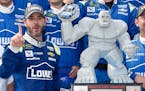 Jimmie Johnson, left, posed with the trophy in Victory Lane after he won a NASCAR Cup series auto race, Sunday, June 4, 2017, at Dover International S