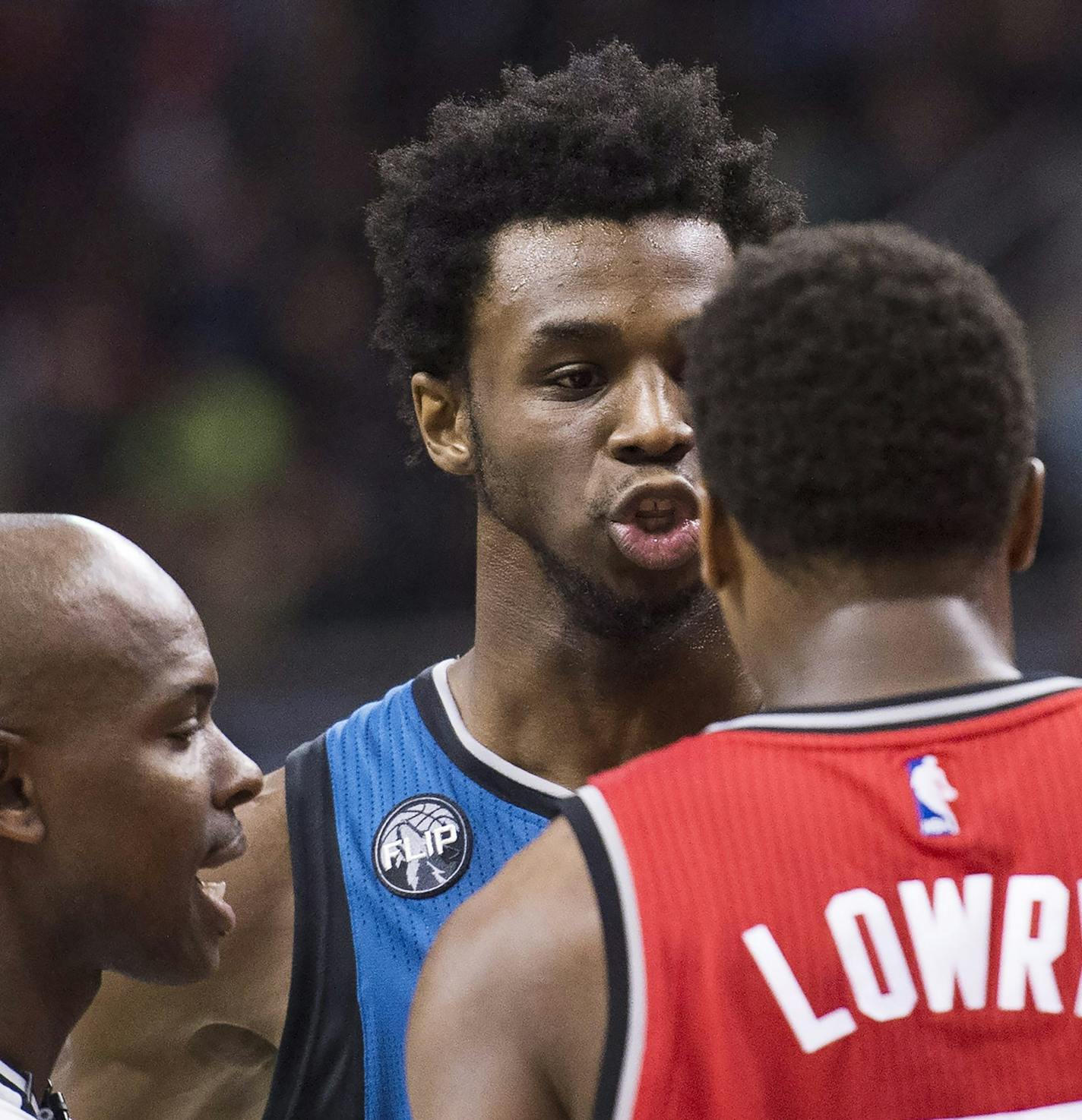 Minnesota Timberwolves guard Andrew Wiggins (22) exchanges words with Toronto Raptors' Kyle Lowry (7) during the second half of an NBA basketball game, Wednesday, Feb. 24, 2016 in Toronto. (Nathan Denette/The Canadian Press via AP) MANDATORY CREDIT