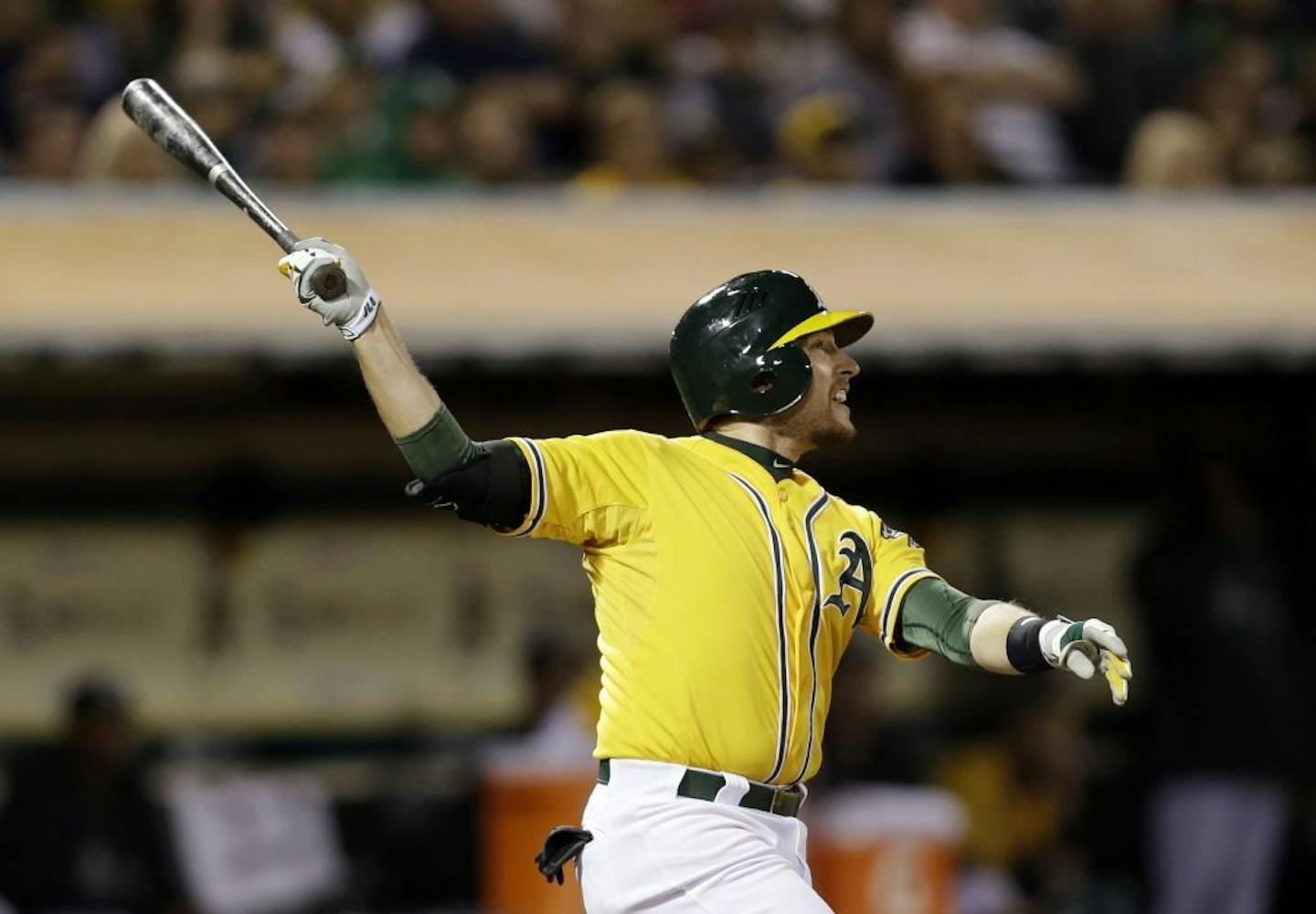 Oakland Athletics' Jed Lowrie hits a three-run home run against the Minnesota Twins during the sixth inning of a baseball game on Thursday, Sept. 19, 2013, in Oakland, Calif.