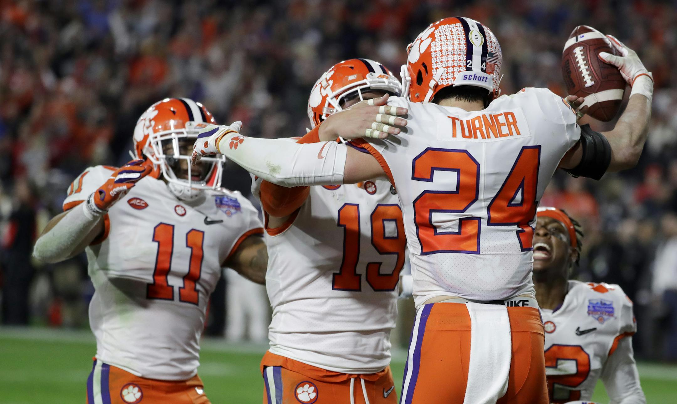 Clemson safety Nolan Turner (24) celebrates after his interception against Ohio State in the final minute of the Fiesta Bowl NCAA college football playoff semifinal Saturday, Dec. 28, 2019, in Glendale, Ariz. (AP Photo/Rick Scuteri)