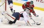 Washington Capitals goalie Braden Holtby defended against Minnesota Wild left wing Zach Parise in the third period as the Wild took on Washington at t