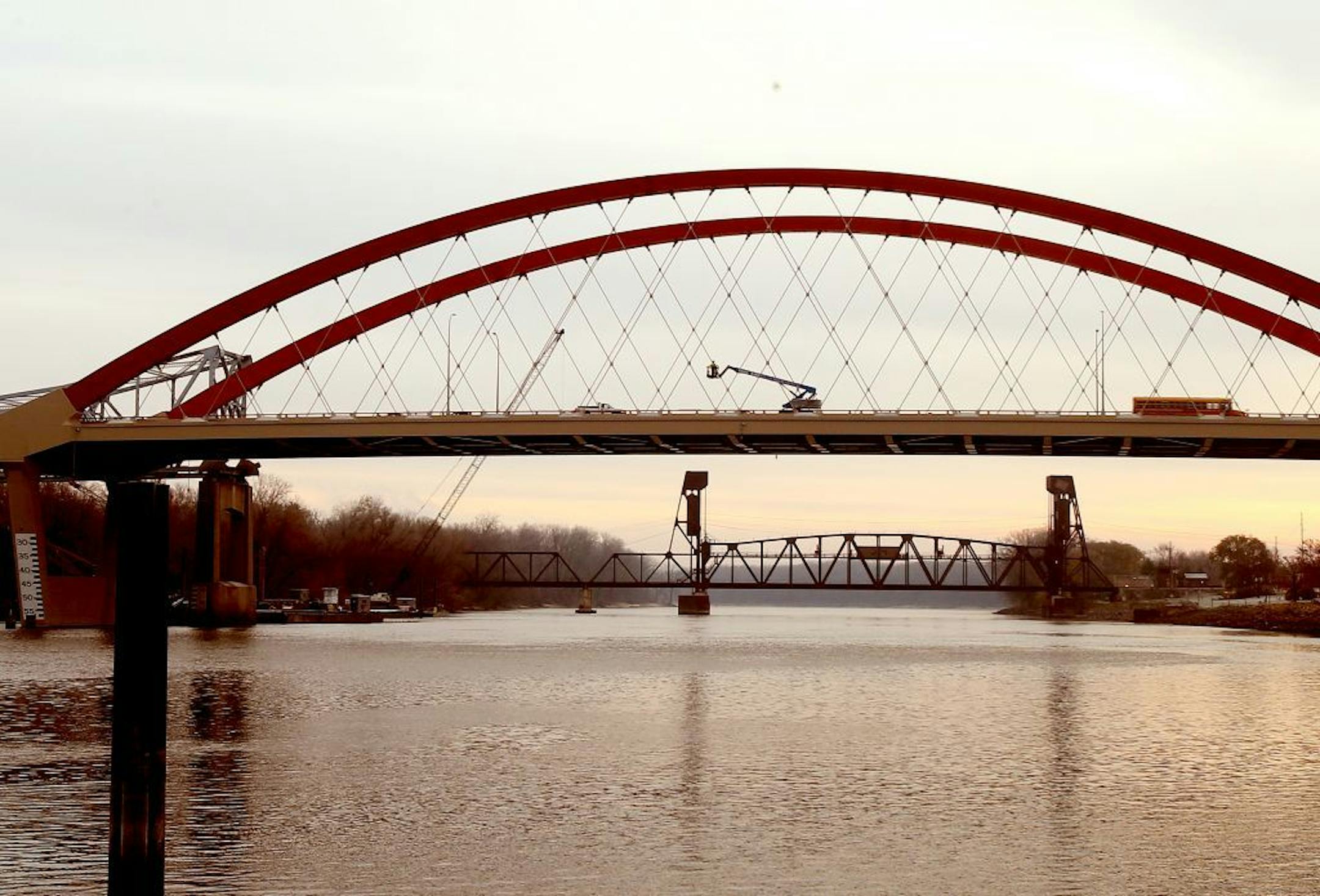 Final touches are being taken care of before the Hastings bridge opens both lanes on Sunday. The Hastings bridge is finally complete after years of construction and traffic is flowing across it. Officials are preparing to open both lanes in both directions for the first time on Sunday. Hastings, MN on November 8, 2013.