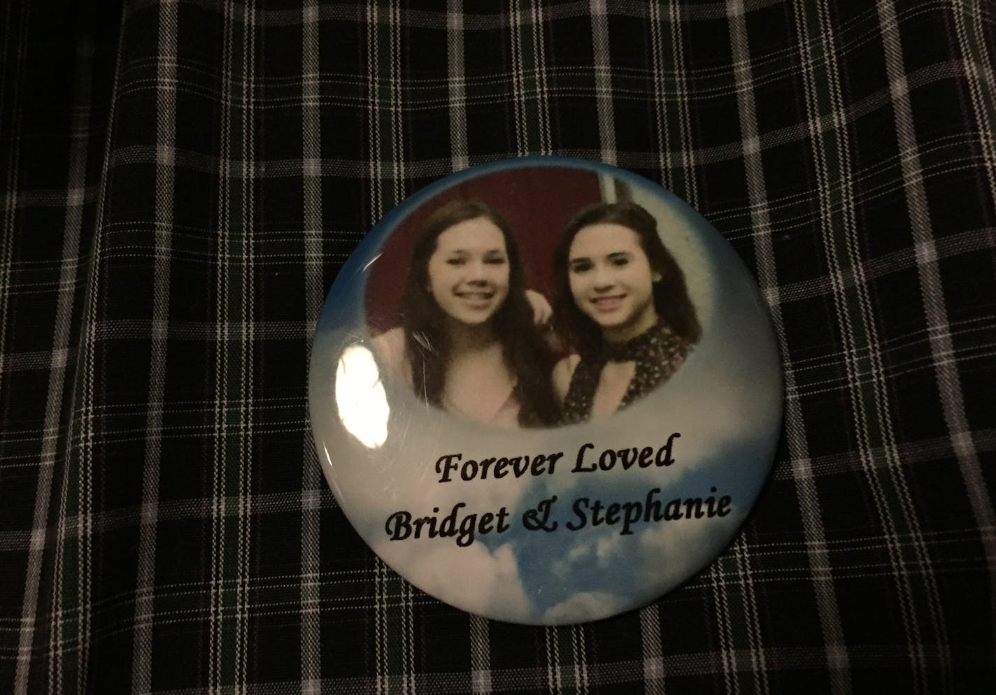 Martin Giere wears a button to memoralize his daugther and her friend, Bridget Giere and Stephanie Carlson, who were killed in a car crash in 2016 while on their way to Mounds View High School. A third girl, Samantha Redden, was badly injured in the crash when a car the girls were riding in was struck by Rachel Kayl. Kayl pleaded guilty Thursday in the case.