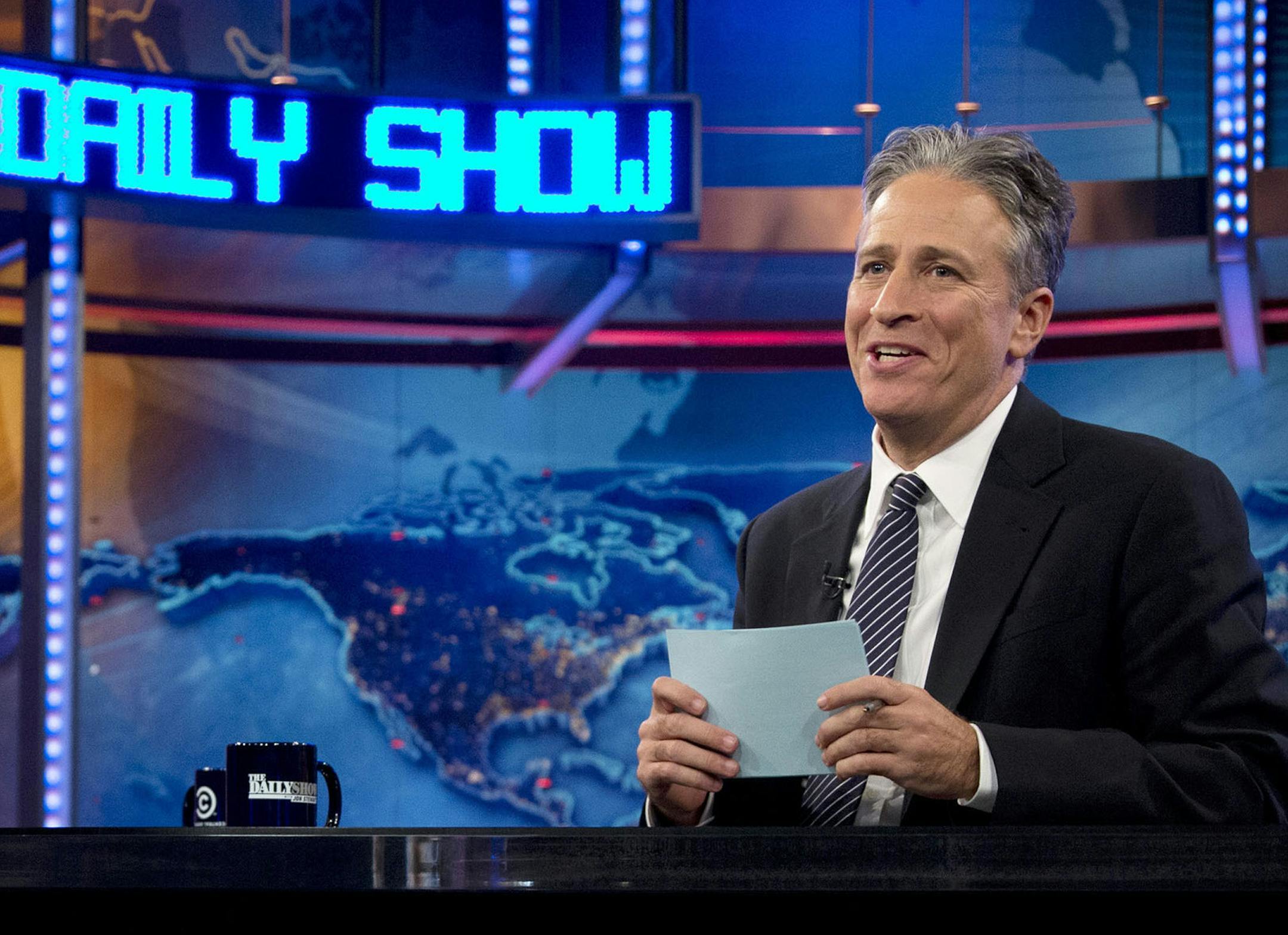 FILE - This Oct. 18, 2012 file photo shows host Jon Stewart during a taping of "The Daily Show with John Stewart", in New York. The program was nominated for an Emmy award for outstanding variety series, Thursday, July 18, 2013. (AP Photo/Carolyn Kaster, file) ORG XMIT: MIN2013083010103208 ORG XMIT: MIN1308301013160003