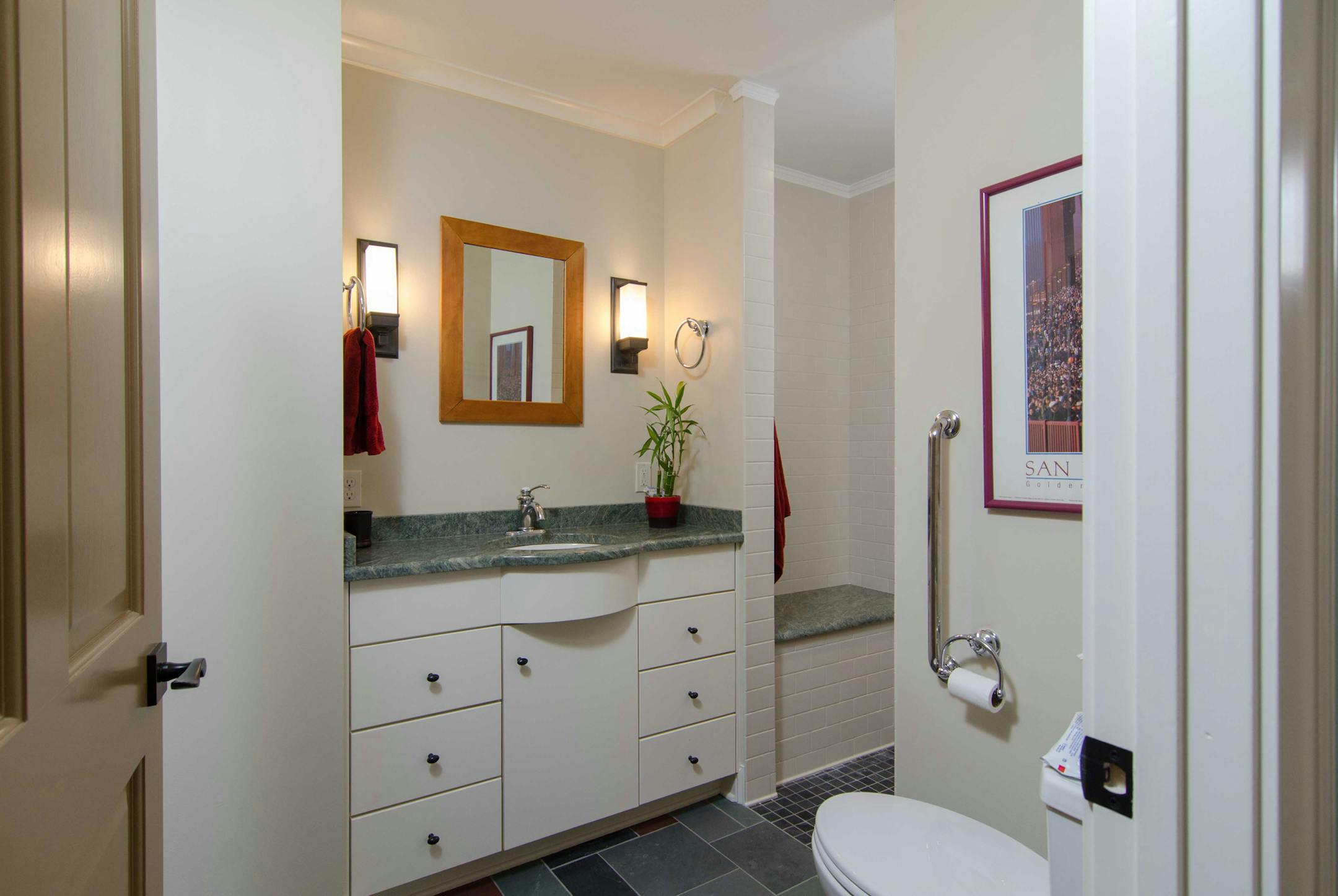 Carlsen & Frank Architects turned a tiny powder room into an accessible bathroom for a homeowner with limited mobility.