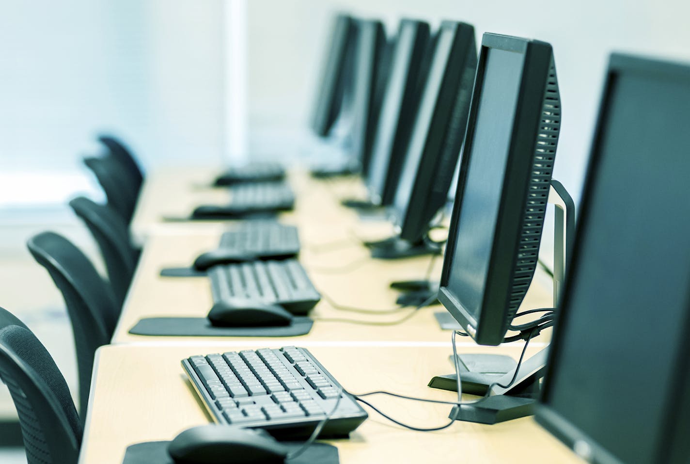 A row of computer monitors and keyboards. TECHNOLOGY PERSPECTIVES Exclusive only at istockphoto. - stevecoleimages - Atlanta, Georgia USA [url=http://www.istockphoto.com/search/lightbox/13905156#10b89ebc [img]http://dl.dropboxusercontent.com/u/40249541/ISP%20Banners/Technology%20Perspectives.jpg[/img][/url]