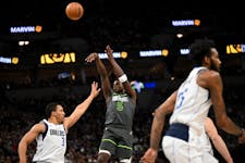 Minnesota Timberwolves guard Anthony Edwards (5) fades back for a three-pointer in the first half against the Mavericks earlier this season. The two t