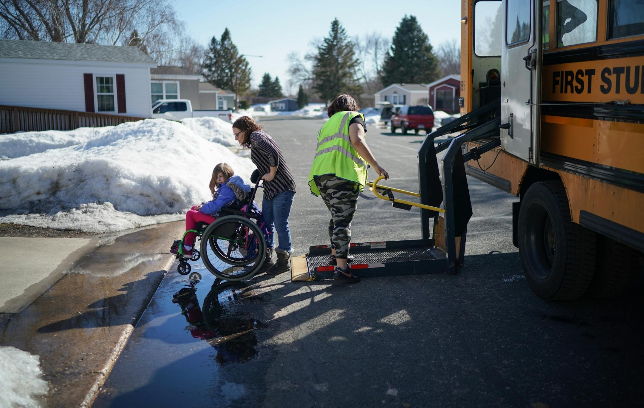 Linsey Rippy waited for her daughter Madi, 12, to get off the school bus after middle school. Madi is a 6th grader.