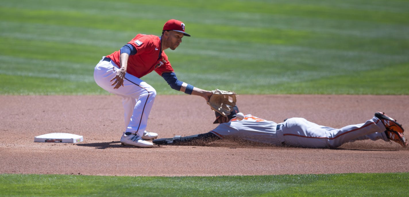 Twins shortstop Andrelton Simmons tagged out Orioles center fielder Cedric Mullins in the first inning of Wednesday's game at Target Field.