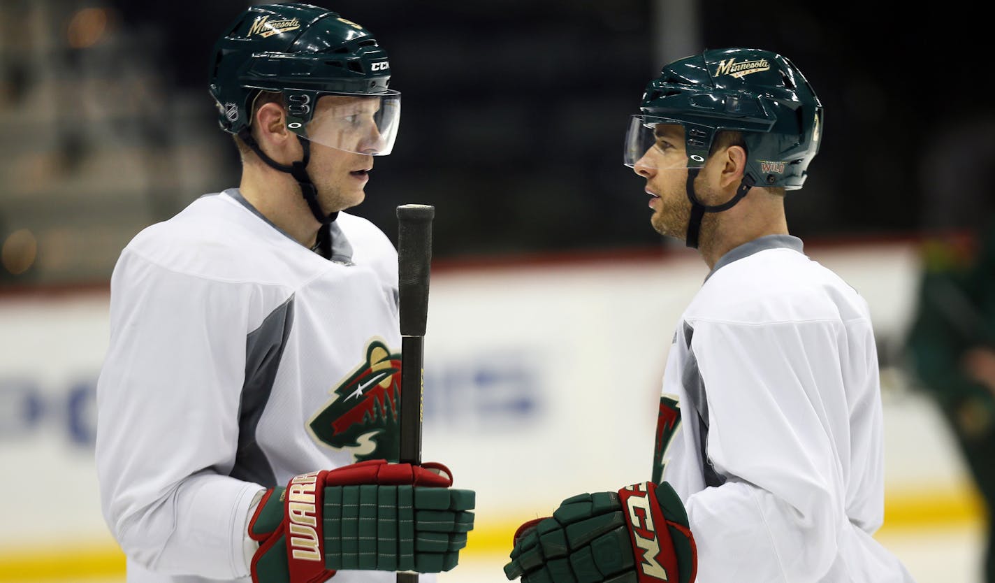 Wild captain Mikko Koivu and right winger Jason Pominville conferred.