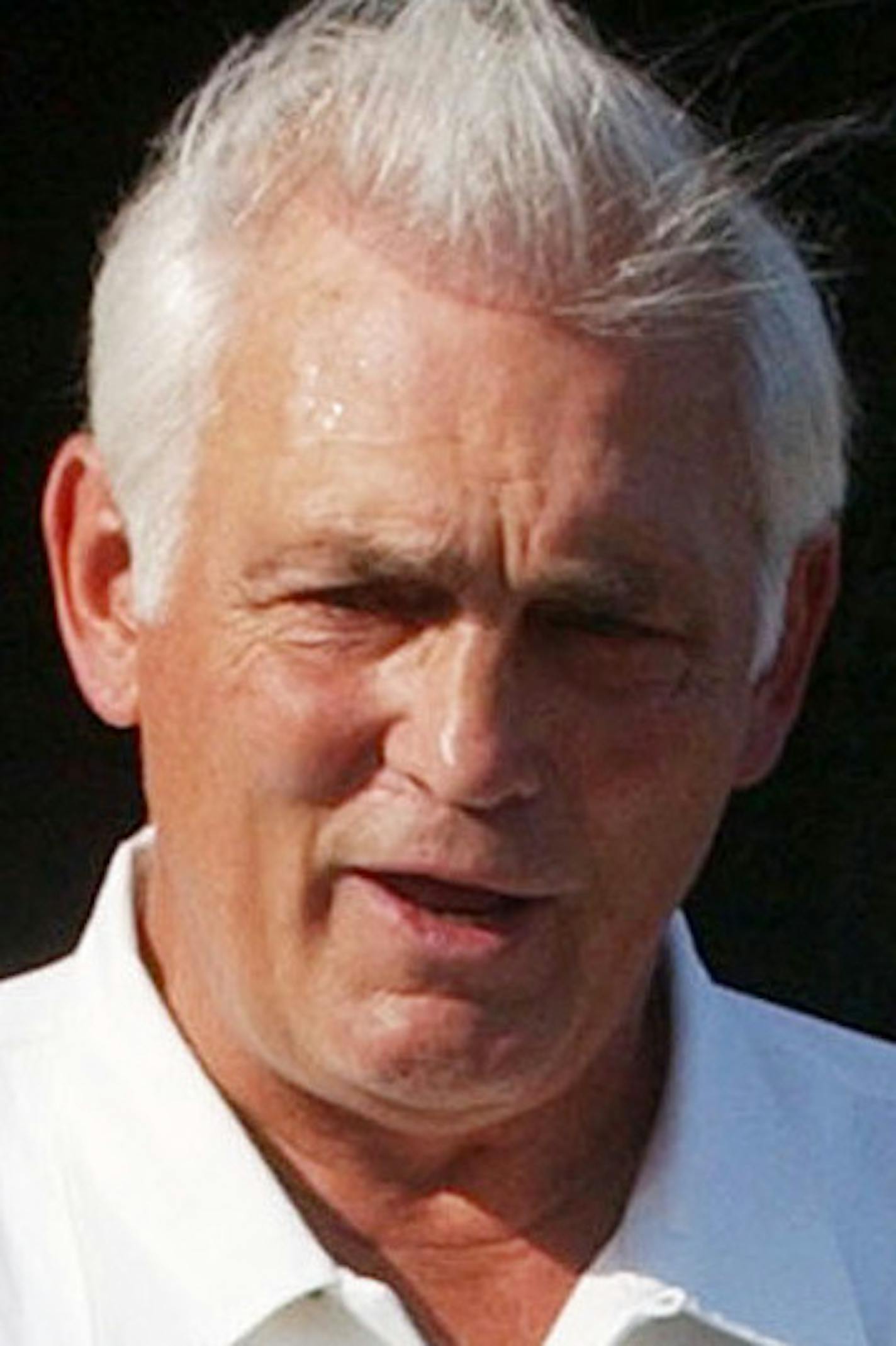 Former Minnesota North Stars general manager Lou Nanne, left, and Olympic hockey player Mark Johnson, right, leave St. Paul Cathedral after paying respects to hockey legend Herb Brooks during a wake Friday, Aug. 15, 2003, in St. Paul, Minn. Brooks, who coached the 1980 U.S. Olympic team to the gold medal, died in a car crash earlier in the week. Johnson was the top scorer on the gold medal team. Nanne was general manager when Brooks coached the North Stars. (AP Photo/Jim Mone) ORG XMIT: MNJM102