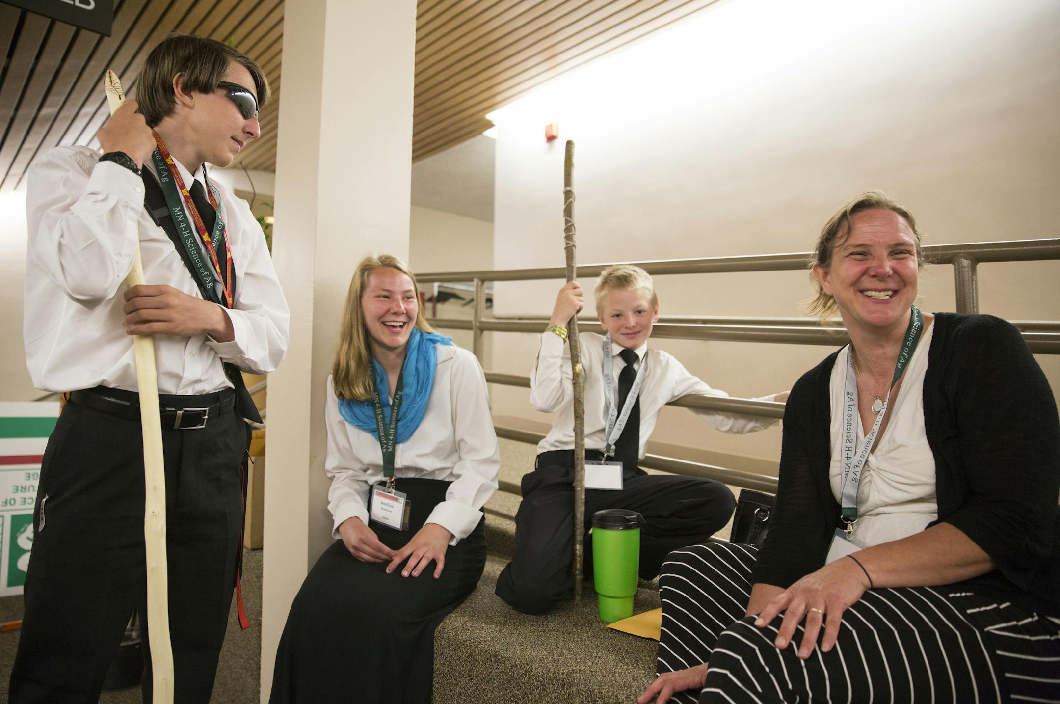 The 4-H team from Anoka County, Madison Arndt, 16, from left, AnnElise Brostrom, 16, Caleb Brostrom, 13, and their coach Therea Brostrom laugh and relax after giving their presentation on using animal fat to kill buckthorn trees. ] (Leila Navidi/Star Tribune) leila.navidi@startribune.com BACKGROUND INFORMATION: The 4-H Science of Agriculture Challenge at the Continuing Education and Conference Center at University of Minnesota Twin Cities in Falcon Heights on Tuesday, June 21, 2016.