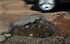 The Park Board is seeking a boost in funding to repair Minneapolis’ 55 miles of parkways. This 2013 pothole was on E. Minnehaha Parkway along Lake N
