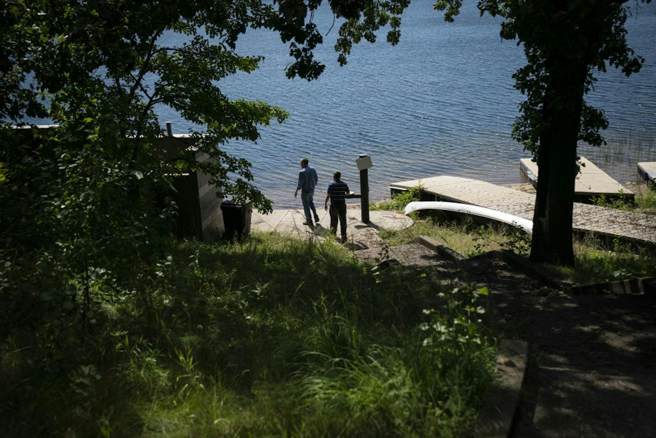 Union Gospel Mission vice president of development Chuck Semrow and media consultant Aaron Hustedde walked around the 17-acre property on Snail Lake that is for sale in Shoreview.