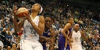 Lynx forward Maya Moore beat the Sparks' Nneka Ogwumike to the basket to score during the first quarter Friday.
