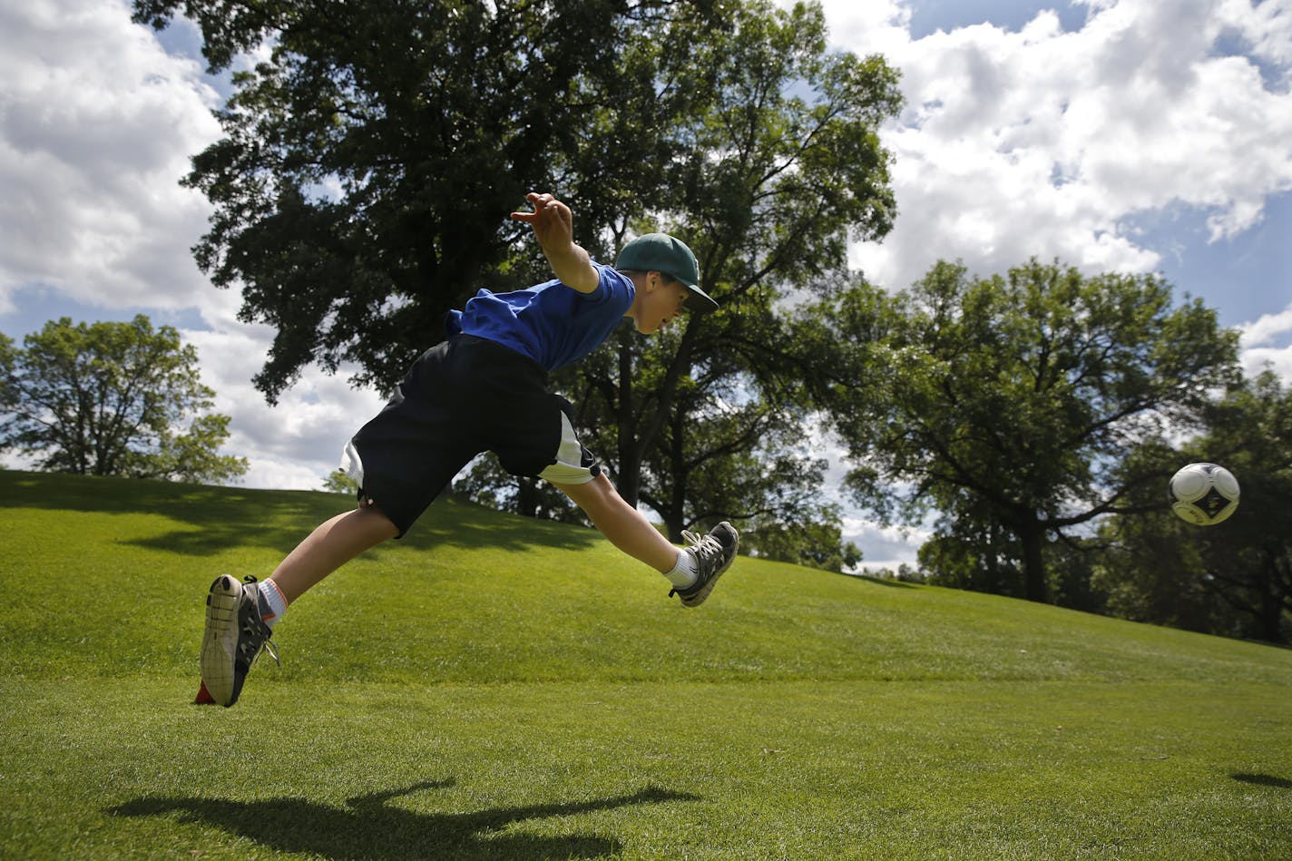 At the Hyland Golf Course in Bloomington on July 16, 2014, footgolf enthusiast A.J. Doll,10 kicked off while playing with his three buddies.]Richard Tsong-Taatarii/rtsong-taatarii@startribune.com