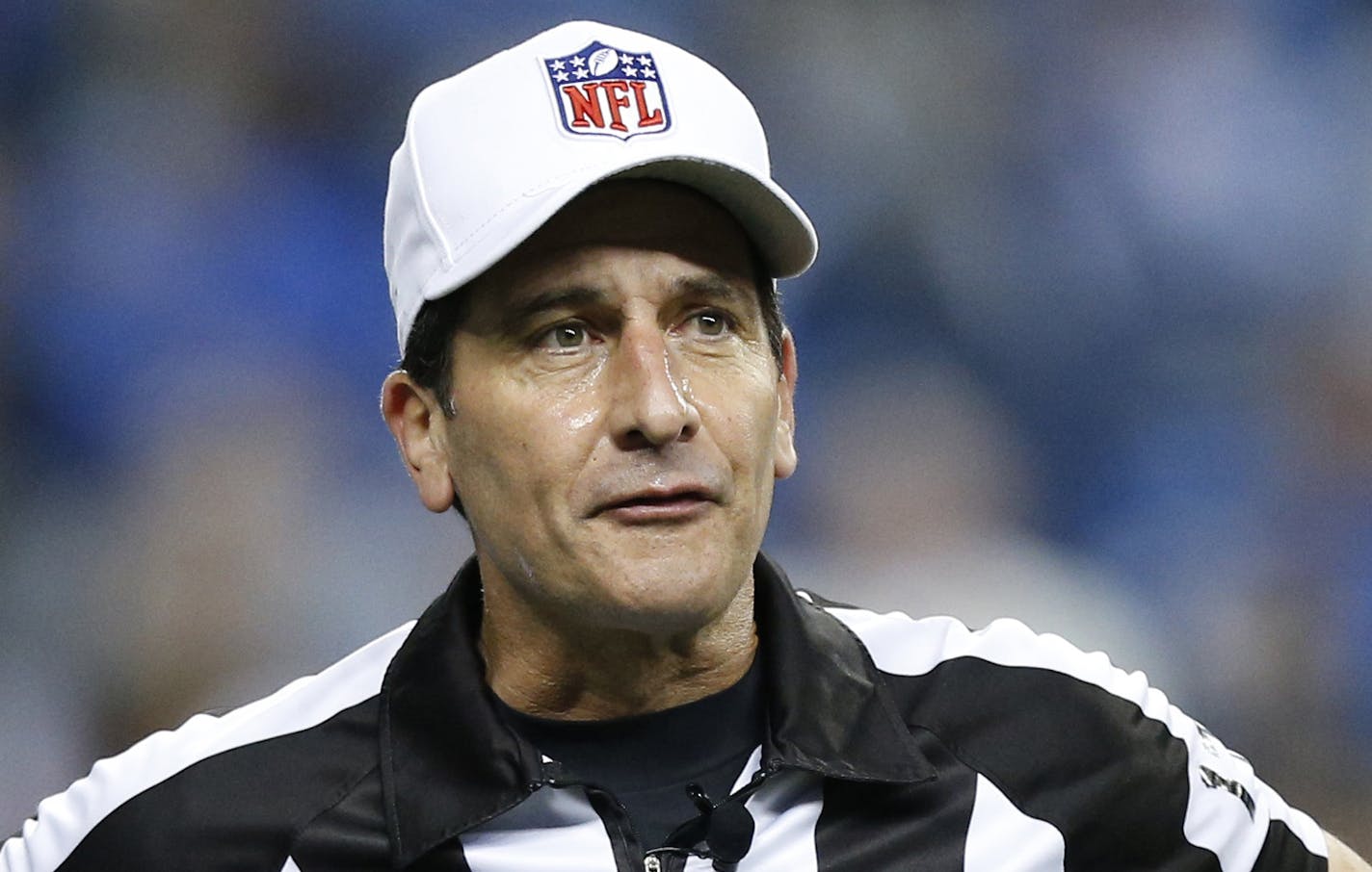 Referee Gene Steratore calls an infraction during the first quarter of an NFL football game between the Detroit Lions and the Atlanta Falcons at Ford Field in Detroit, Saturday, Dec. 22, 2012. (AP Photo/Rick Osentoski) ORG XMIT: otkco118