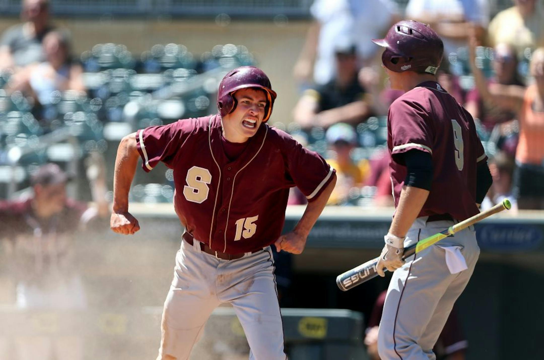 Joe Pieschel left, celebrated with Tanner Vogel after scoring the go-ahead run for Springfield in the 11th inning of the 1A title game at Target Field.