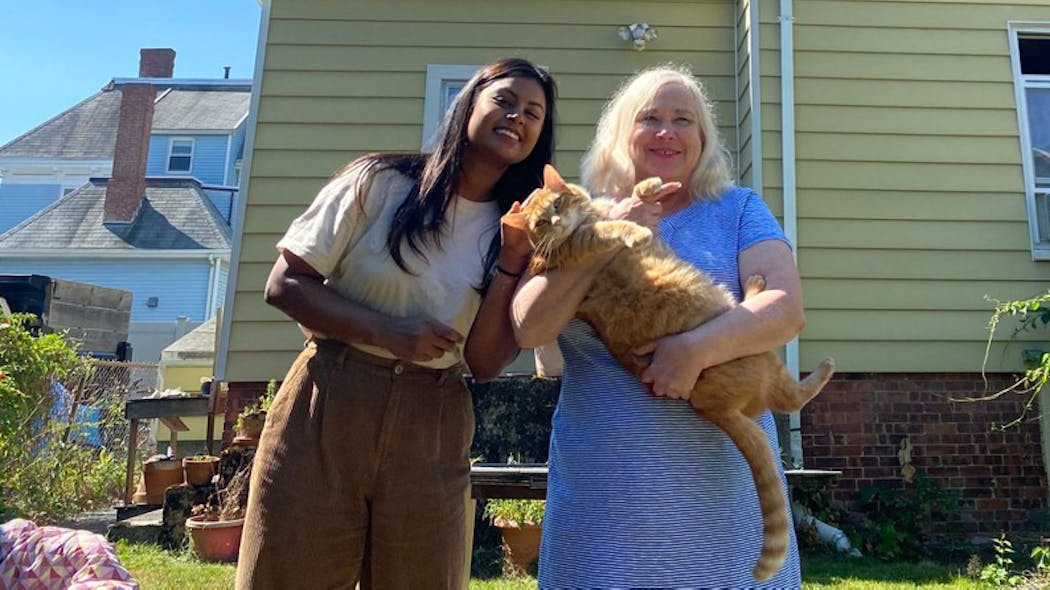 Nadia Abdullah, 25, with Judith Allonby, 64, holding Mango the cat, have been roommates in Malden, Mass., since May 2019. 