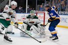 St. Louis Blues' Ryan O'Reilly (90) watches the puck as Wild goaltender Kaapo Kahkonen and Ryan Suter defend during the second period Friday night.