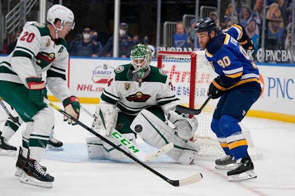 St. Louis Blues' Ryan O'Reilly (90) watches the puck as Wild goaltender Kaapo Kahkonen and Ryan Suter defend during the second period Friday night.