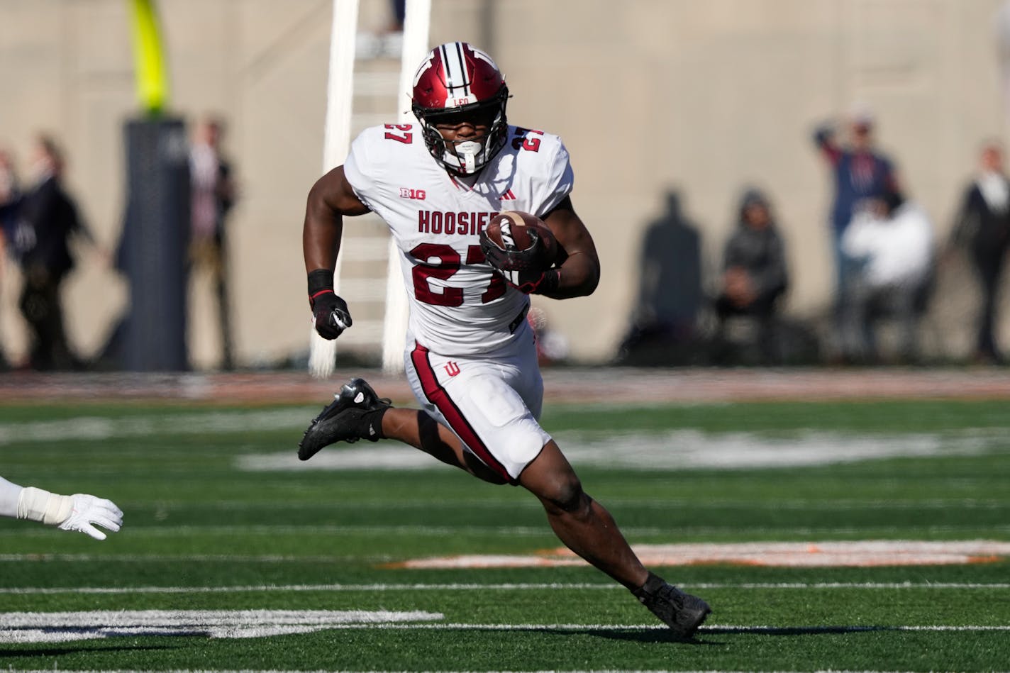 Indiana running back Trent Howland carries the ball during the first half of an NCAA college football game against Illinois Saturday, Nov. 11, 2023, in Champaign, Ill. (AP Photo/Charles Rex Arbogast)