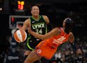 Napheesa Collier of the Lynx was stopped by Connecticut guard DiJonai Carrington during a game at Target Center on June 22.