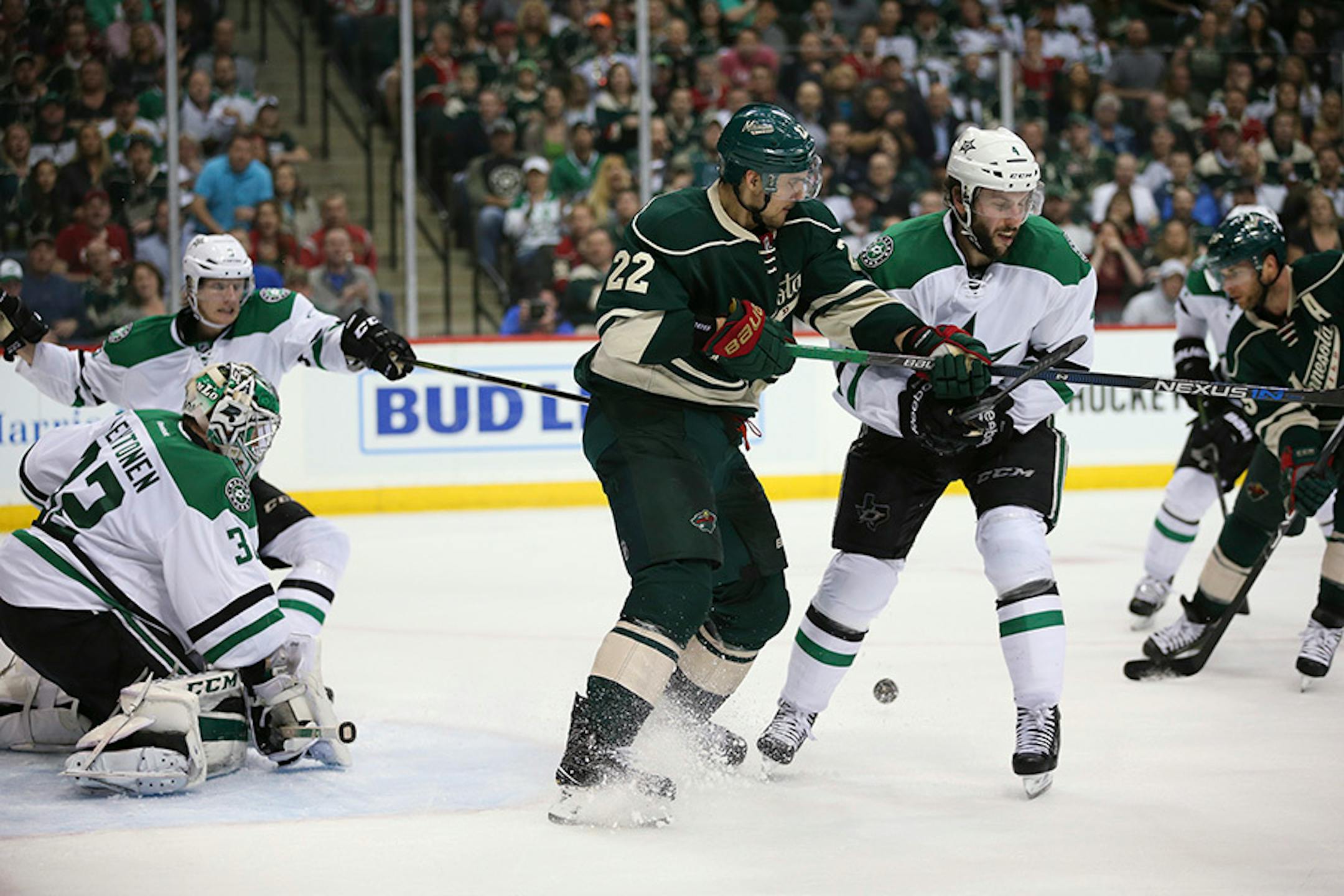 Wild right wing Jason Pominville (29), right, scored the go ahead goal in the second period Monday night while the Wild's Nino Niederreiter (22) tied up Dallas Stars defenseman Jason Demers (4) in front of Dallas goalie Kari Lehtonen.