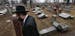 Rabbi Hershey Novack of the Chabad center walks through Chesed Shel Emeth Cemetery in University City, Mo., on Tuesday, Feb. 21, 2017, where almost 20