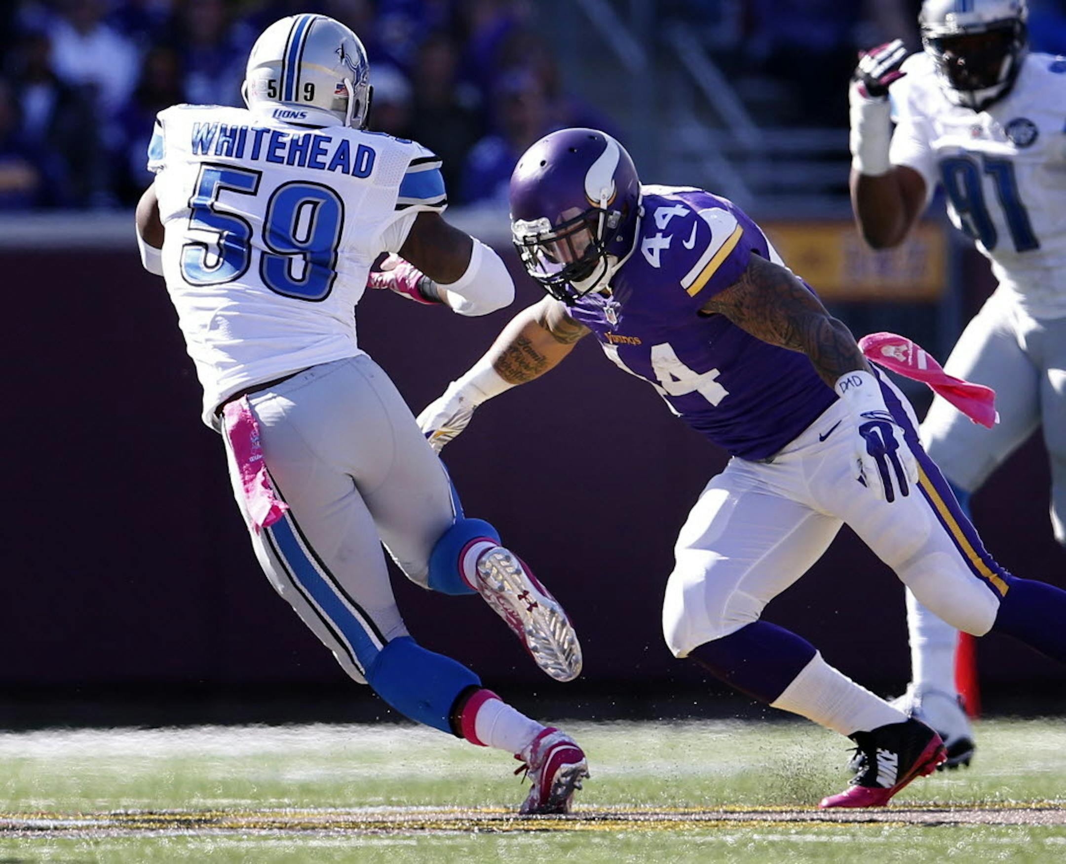 Matt Asiata (44) tackled Tahir Whitehead (59) after Whitehead intercepted a Teddy Bridgewater pass in the second quarter.