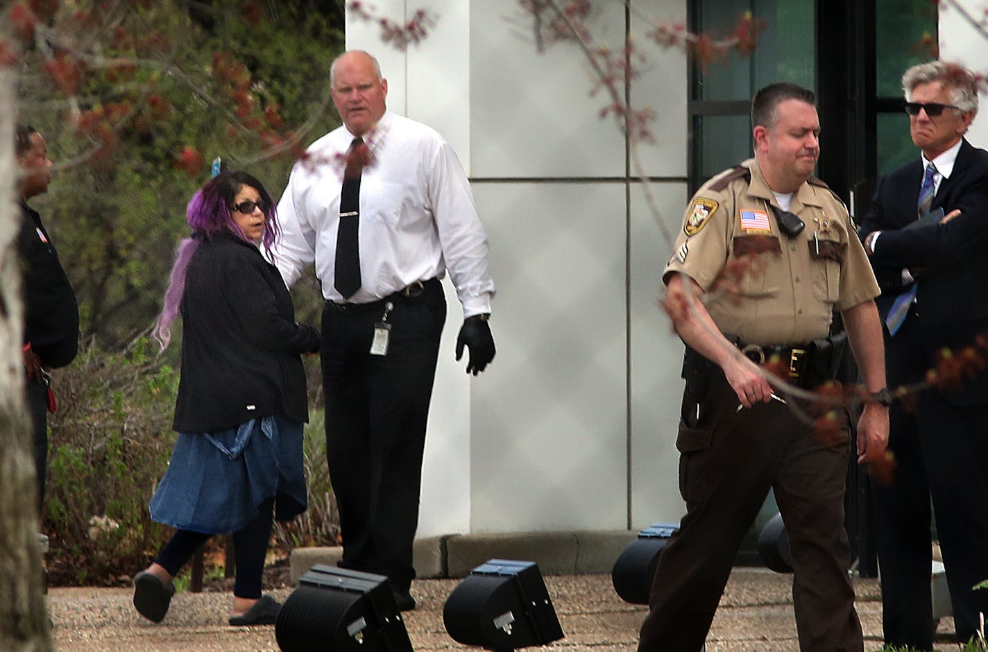 Tyka Nelson (facing camera at left), sister of Prince, walked past law enforcement officials as when entered Paisley Park, early on the afternoon her brother was found dead at the complex in Chanhassen. ] JIM GEHRZ &#xef; james.gehrz@startribune.com / Chanhassen, MN / April 21, 2016 /12:30 PM &#xf1; BACKGROUND INFORMATION: Prince found dead at Paisley Park in Chanhassen. Police officials, relatives and friends entered and left the compound all day, while mourners left flowers and signs at a make