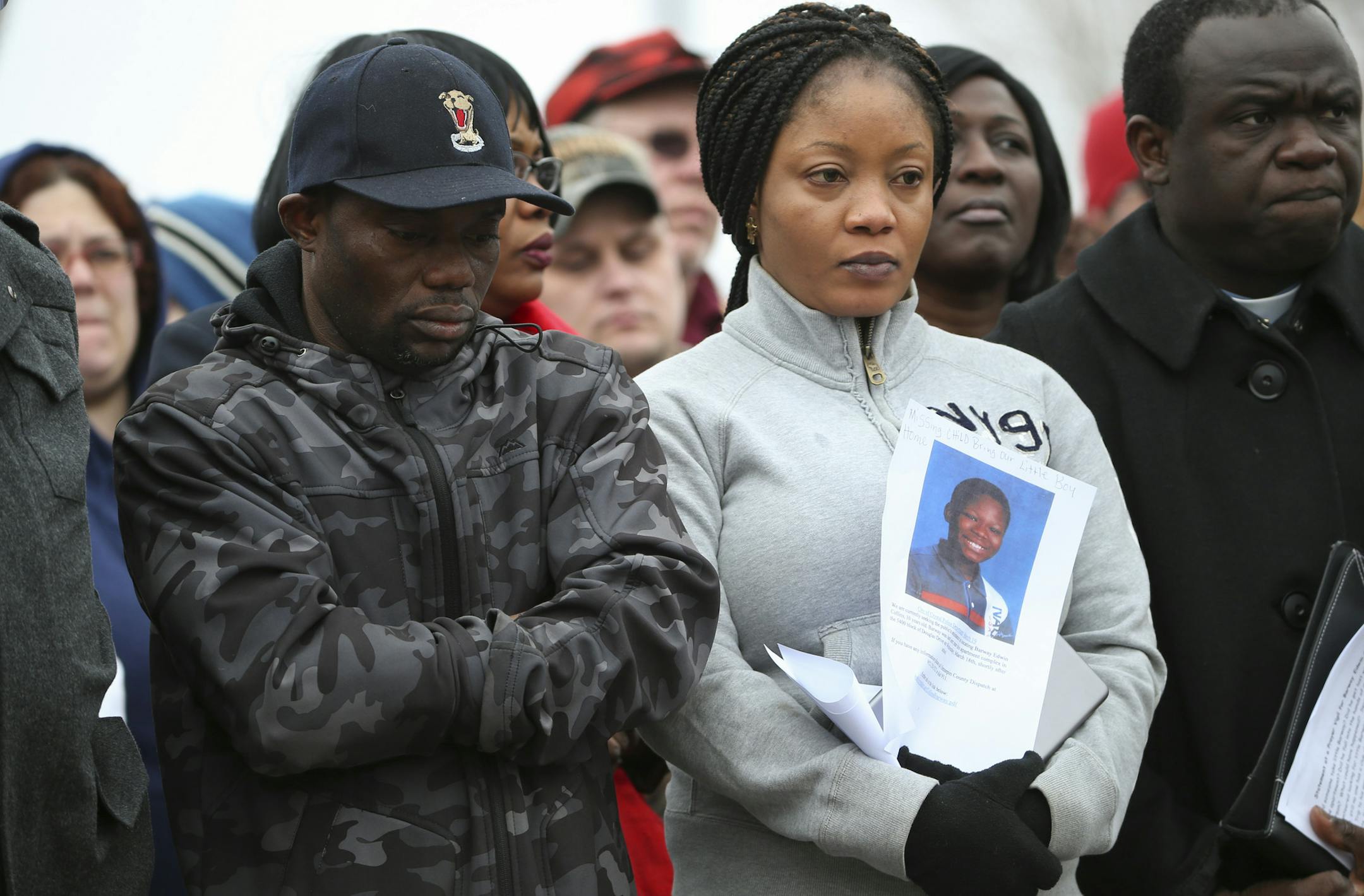 Barway's parents, Pierre and Yamah Collins stood with supporters at the vigil Monday afternoon in Crystal. ] JEFF WHEELER ï jeff.wheeler@startribune.com Family, friends, neighbors and members of the Liberian community gathered in the parking lot of the apartment complex in Crystal where his family lives to hold a prayer vigil for Barway Collins, the 10-year-old boy who has been missing since Wednesday.