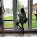 Students check their phones between classes at Carlton High School.