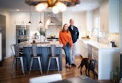 Empty nesters Kellie and Phil Schechinger, pictured with their dog, Marley, recently updated their Edina home to accommodate their casual lifestyle.