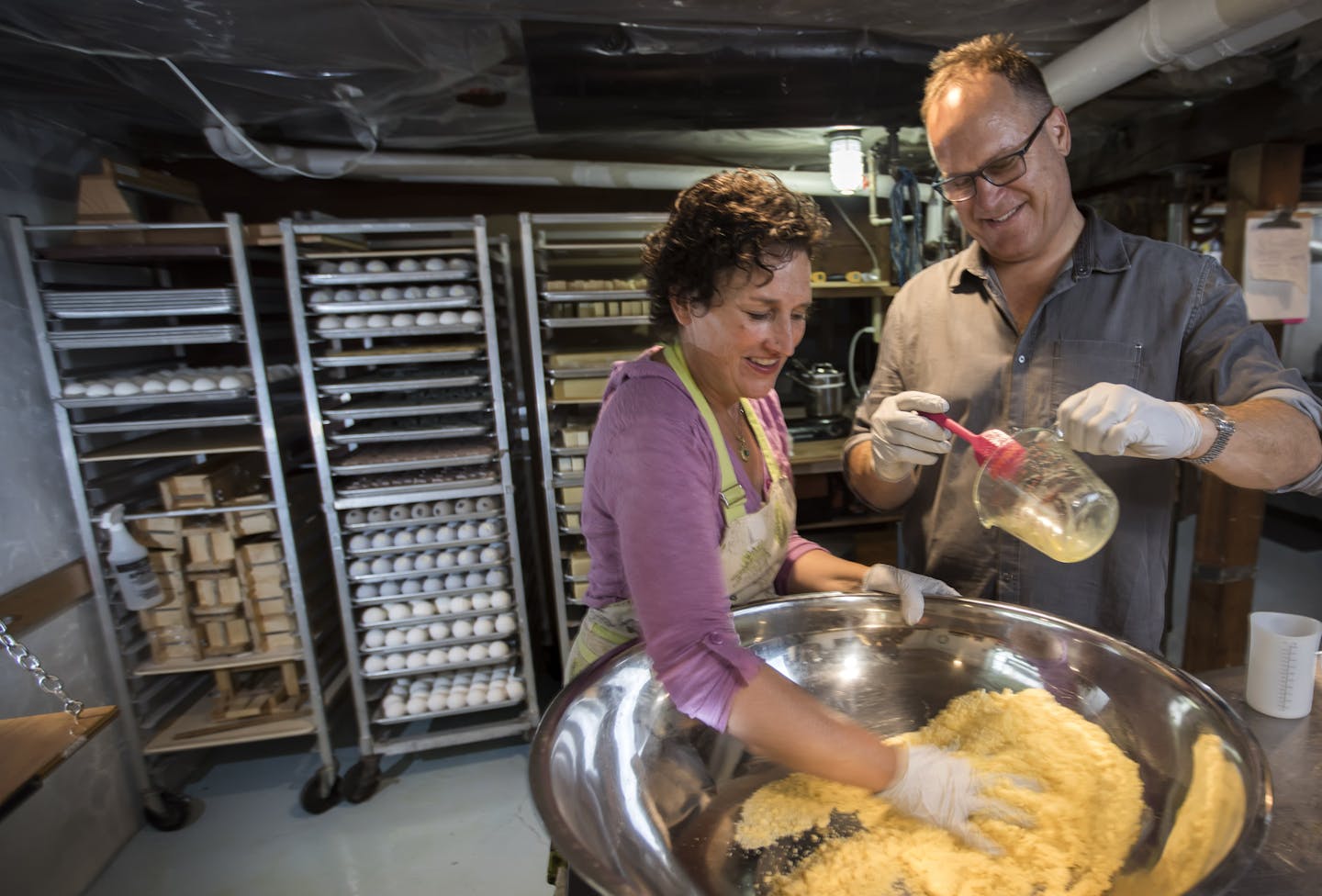 Nora and Jay Schaper prepare a batch of Bath Bombs in their basement lab. One percent of annual revenue is donated to Clean Water Action.