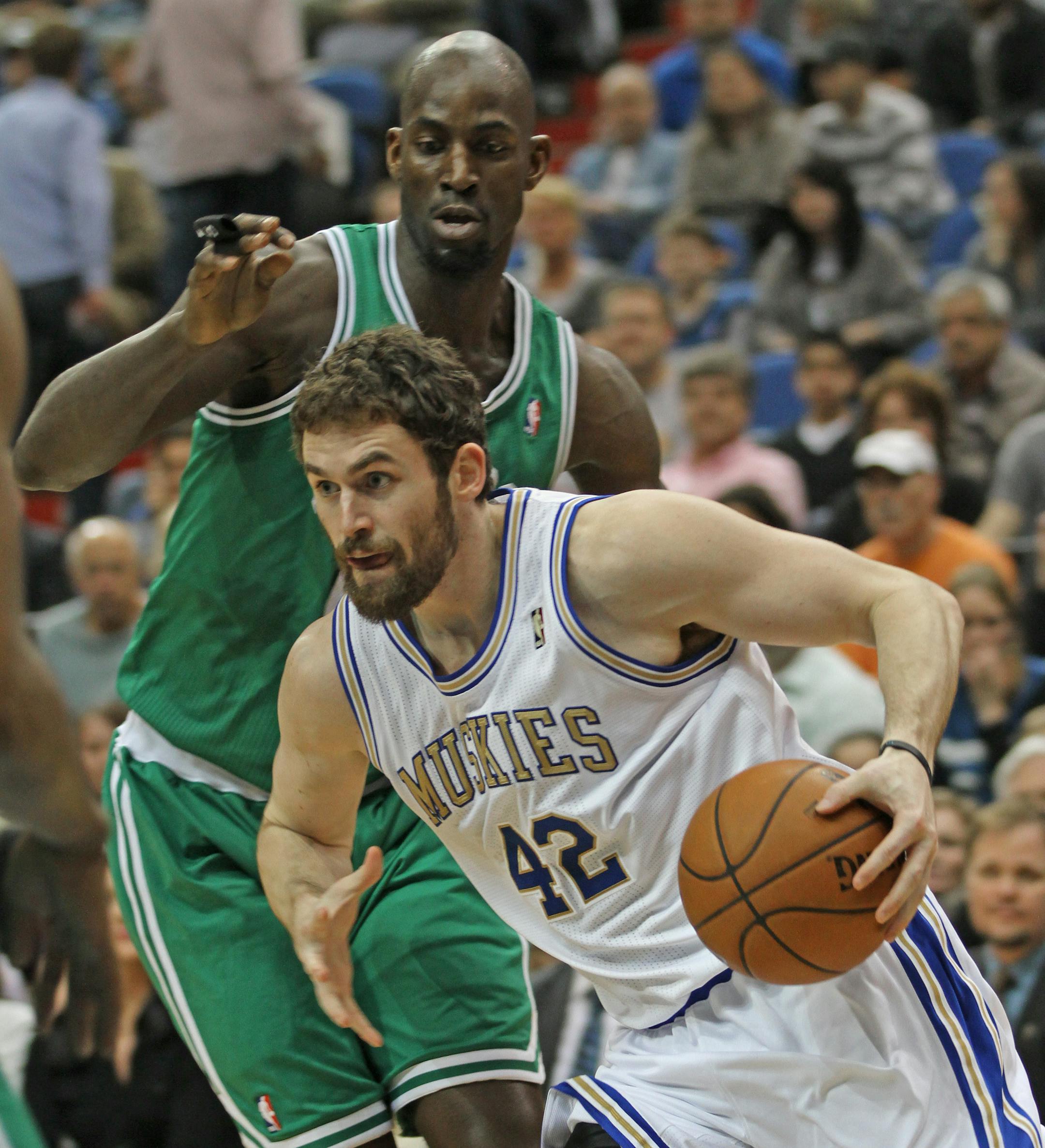 Minnesota Timberwolves vs. Boston Celtics, Target Center, 3/30/12. (left to right) Boston's Kevin Garnett defended as Minnesota's Kevin Love drove to the basket.] Bruce Bisping/Star Tribune, bbisping@startribune.com