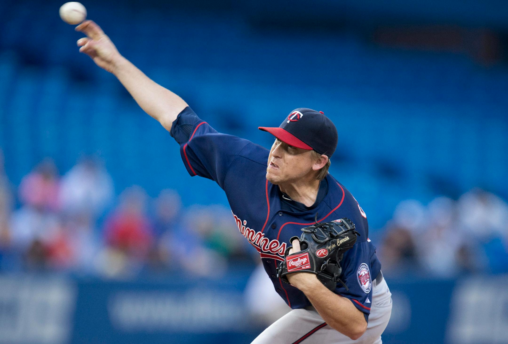 Minnesota Twins starting pitcher Kevin Correia works against the Toronto Blue Jays during the first inning of a baseball game in Toronto on Friday, July 5, 2013. (AP Photo/The Canadian Press, Frank Gunn)