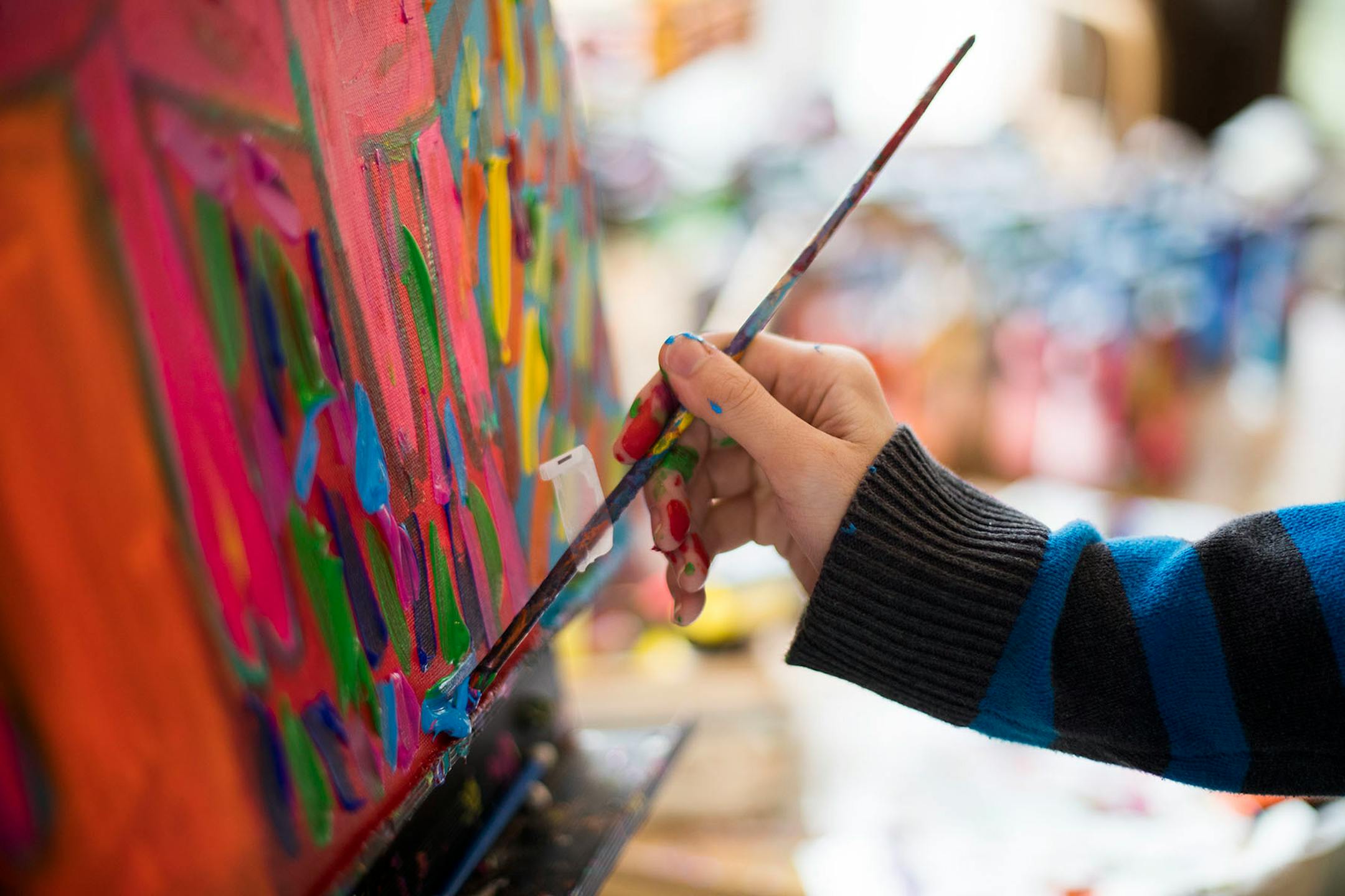 Jimmy Reagan paints inside his home studio.