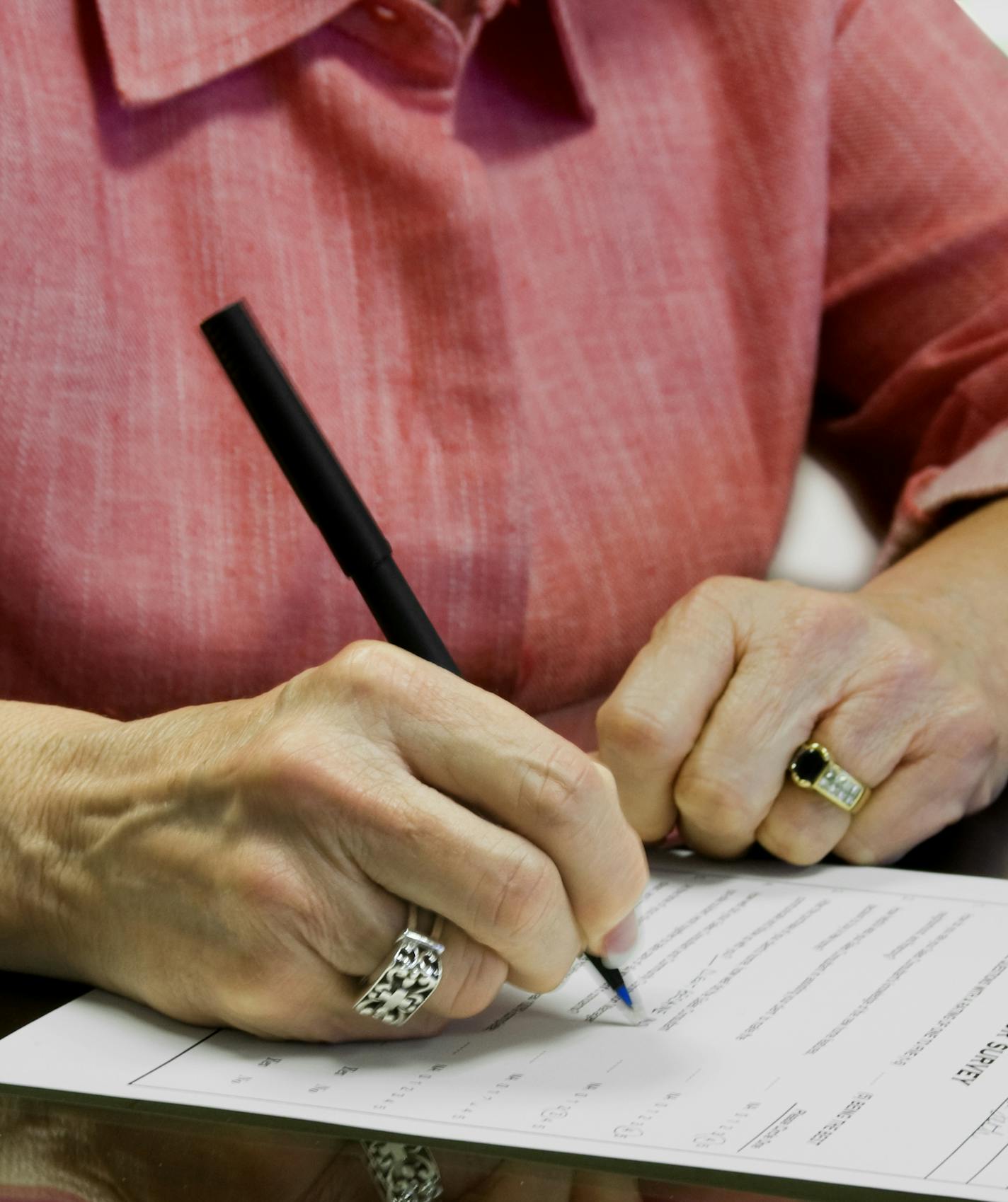 Senior Citizen Signing a Document. istock