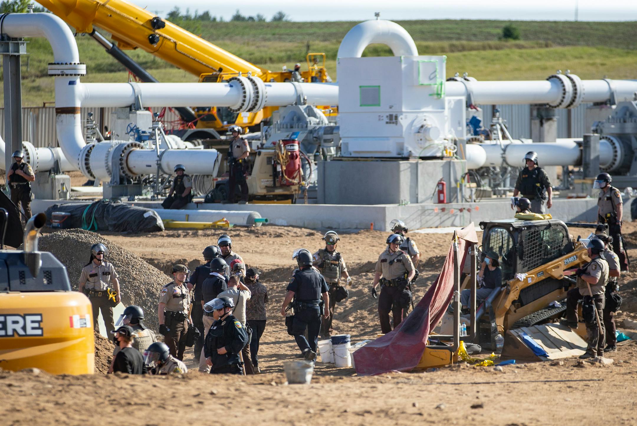 Indigenous protestors and their allies occupied an active Enbridge pump station, some physically chaining themselves to equipment, on Monday, forcing over forty workers to leave.