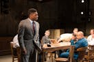 Curtis Bannister (left) tries to sway his fellow jurors in Theater Latté Da’s “Twelve Angry Men.”