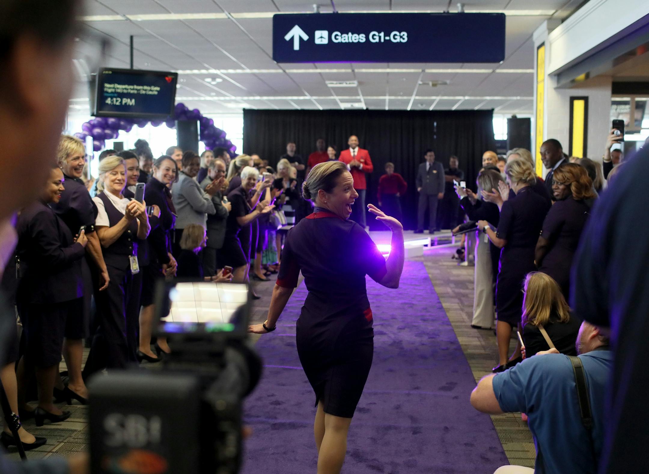 Delta Air Lines launched its new line of uniforms for all its employees during a fashion show at MSP with designer Zac Posen & manufacturer Lands End showcasing the new look Tuesday, May, 29, 2018, at Terminal 1 between Gates G1-G3 at the Minneapolis-St. Paul International Airport in Bloomington, MN. Here,Mary Hitchcock on the runway with the ACS signature dress.