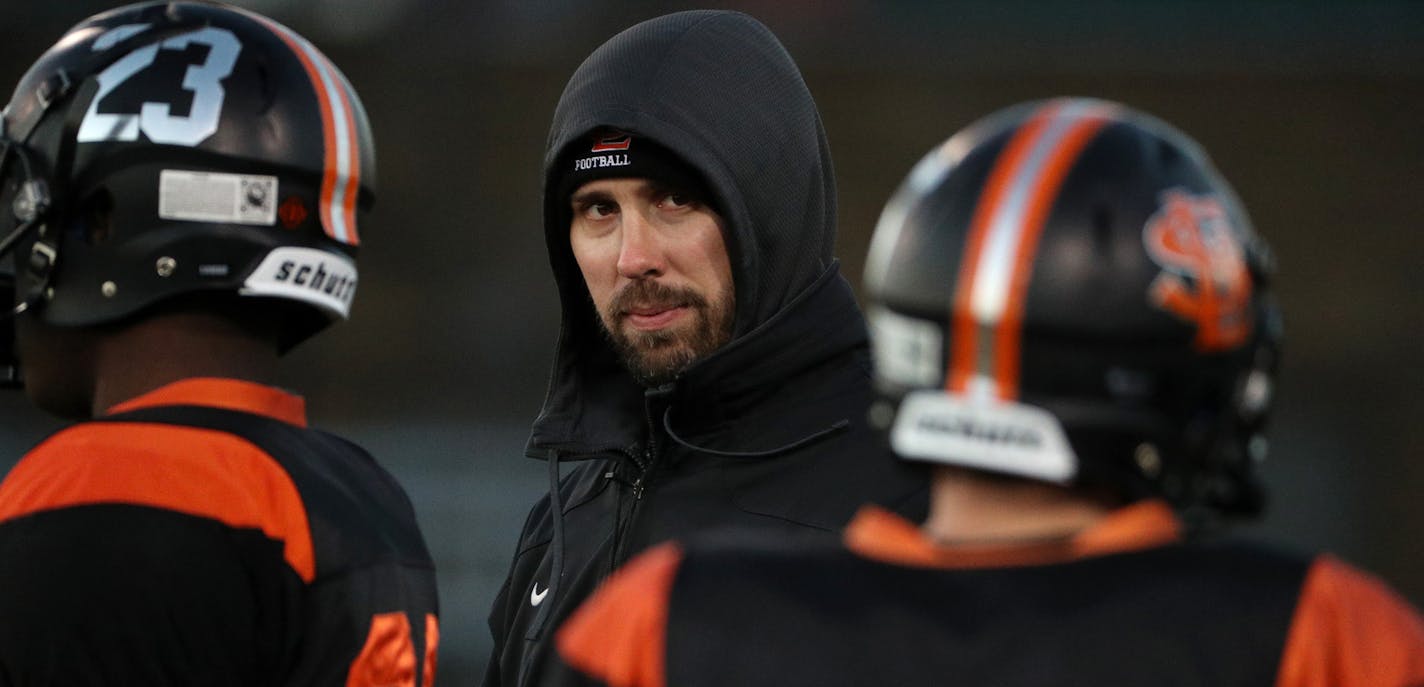 Coach Ben Wolfe watched his Orioles practice for their Class 5A state quarterfinal vs. Brainerd on Friday in St. Cloud.