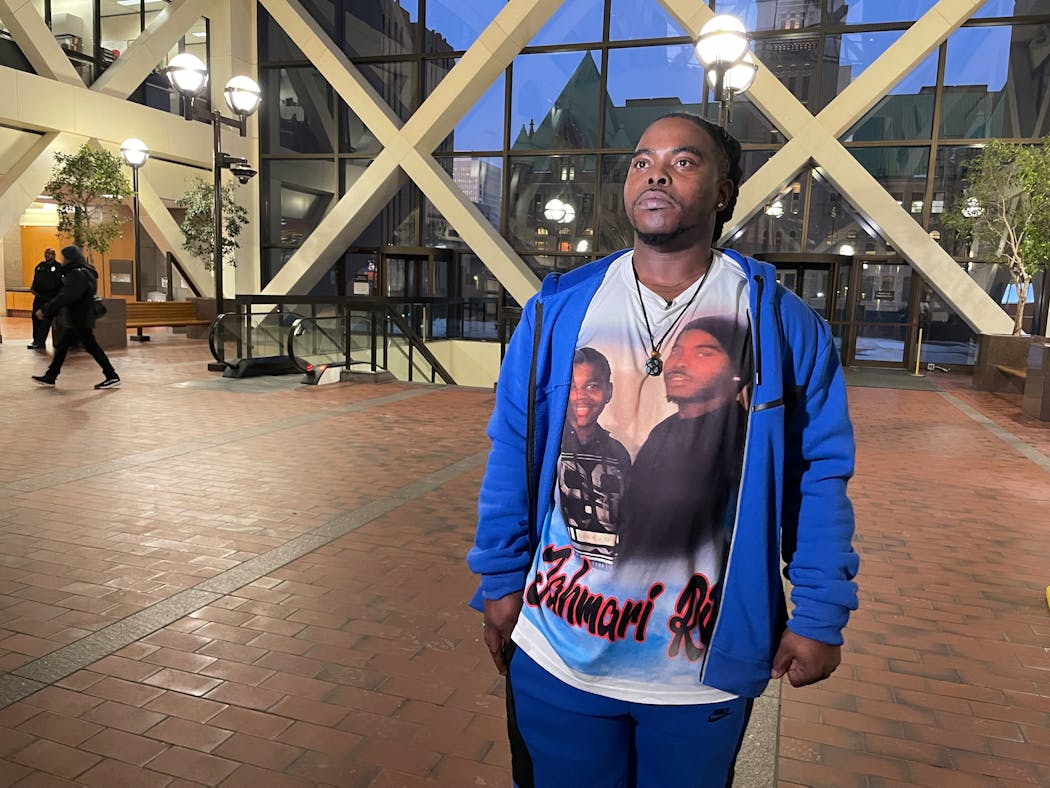 Cortez Rice stood into the atrium of the Hennepin County Government Center after a jury found Alfredo Rosario Solis not guilty in his son Jahmari’s shooting death.
