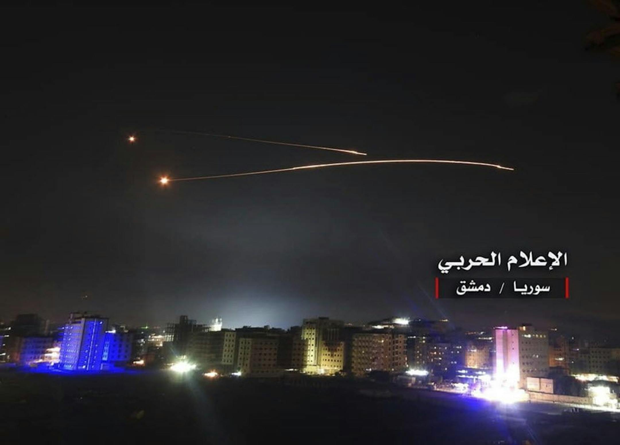 This photo provided early Thursday, May 10, 2018, by the government-controlled Syrian Central Military Media, shows missiles rise into the sky as Israeli missiles hit air defense position and other military bases, in Damascus, Syria. The Israeli military on Thursday said it attacked "dozens" of Iranian targets in neighboring Syria in response to an Iranian rocket barrage on Israeli positions in the Golan Heights, in the most serious military confrontation between the two bitter enemies to date.