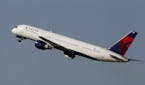 File-This photo taken Jan. 20, 2011, shows a Delta Airlines Boeing 757 taking off in Tampa, Fla. Delta Air Lines is making fundamental changes to its 